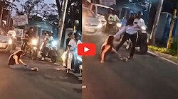 Viral Video: నడిరోడ్డుపై కూర్చున్న యువతి.. నిలిచిపోయిన వాహనాలు.. చివరికి ఏం జరిగిందో చూడండి.. 