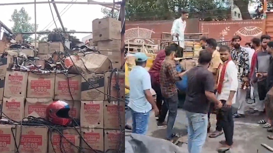 Hyderabad: మద్యం లోడ్‌తో వెళ్తున్న లారీకి మంటలు.. బాటిళ్ల కోసం ఎగబడ్డ జనాలు.. హైదరాబాద్‌లో  ఘటన..