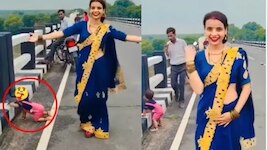 Video Viral: అసలు నువ్వు తల్లివేనా..?.. బ్రిడ్జ్ అంచున పసికందు.. రీల్స్ మోజులో మహిళ.. వీడియోపై దుమారం..