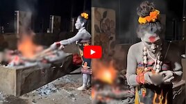 కాలుతున్న చితిలోని శవం ముక్క తీసుకుని తిన్న అఘోరీ.. వైరల్ వీడియో!	