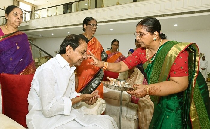 CM-KCRs-sisters-ties-rakhi-to-him-kcr-touches-his-sisters-feet-for-blessings-during-rakha-bandhan-festival-2023-kcr-sisters-photos.jpg