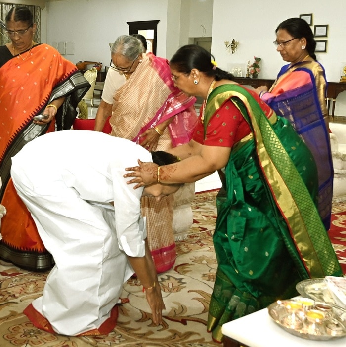 CM-KCRs-sisters-ties-rakhi-to-him-kcr-touches-his-sisters-feet-for-blessings-during-rakha-bandhan-festival-2023.jpg