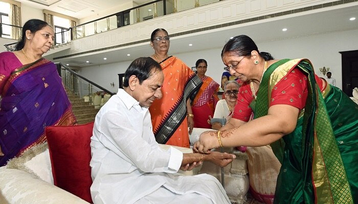 CM-KCRs-sisters-ties-rakhi-to-him-kcr-touches-his-sisters-feet-for-blessings-on-rakhi-festival-2023.jpg