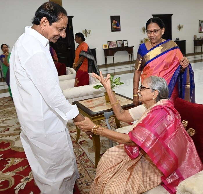 CM-KCRs-sisters-ties-rakhi-to-him-kcr-touches-his-sisters-feet-for-blessings-on-rakhi-festival.jpg