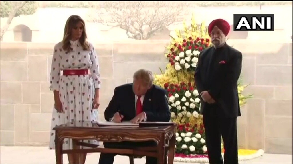 Donald Trump signs visitors book at Raj ghat