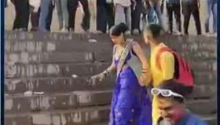 Holi 2024 some goons are throws water at couple at manikarnika ghat in varanasi video goes viral pa