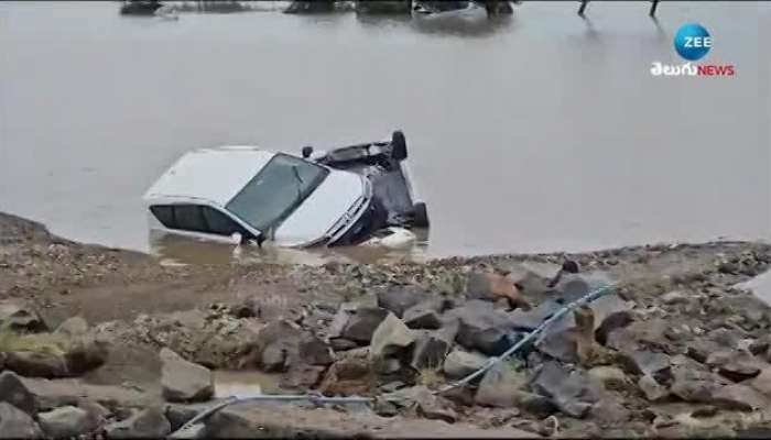 Car Washed Away In Flood Water in Nandigama video viral rn